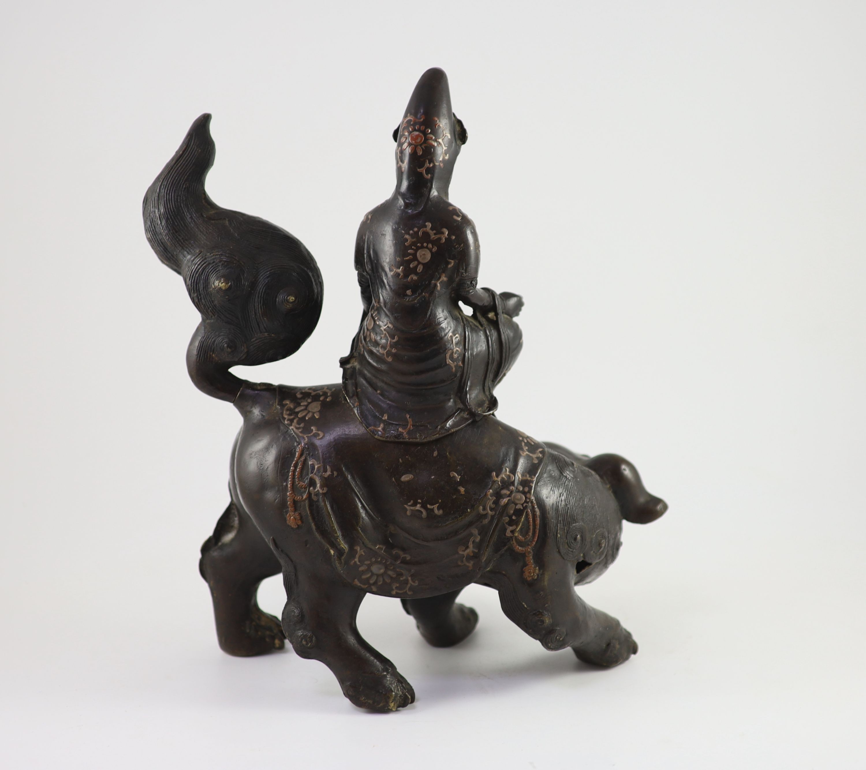 A large Chinese/Japanese bronze censer modelled as Wenshu riding a lion-dog, 17th/18th century 40 cm high, 35 cm long